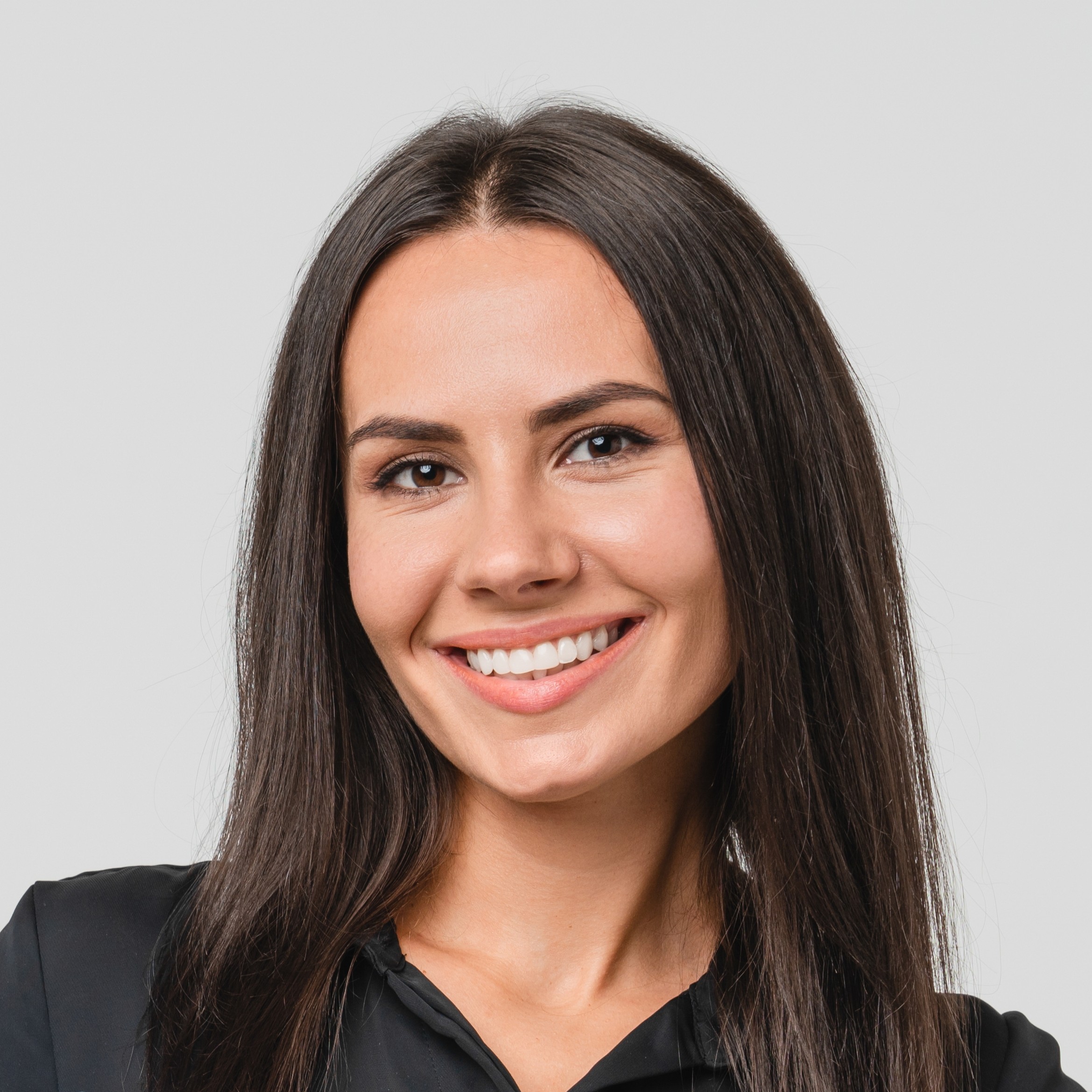 Female young businesswoman auditor inspector examiner controller in formal wear writing on clipboard, checking the quality of goods and service looking at camera isolated in white background